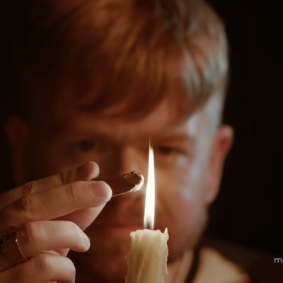 William Courteney (Marcus Houden) melts a stick of sealing wax
